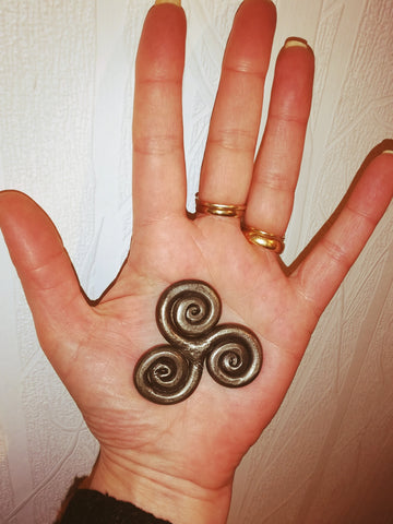 Hand forged steel pocket triskele