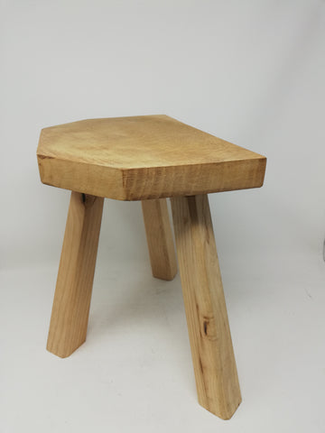 Traditional 3 legged wooden milking stool.