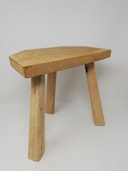 Traditional 3 legged wooden milking stool.