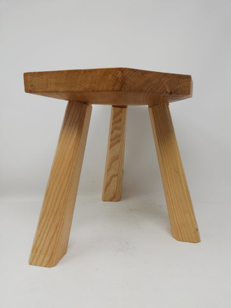 Traditional 3 legged wooden milking stool.