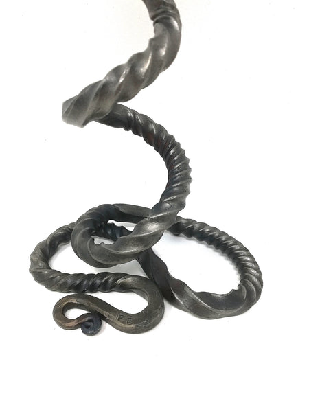 Tall 'basilisk' candle holder, hand forged.