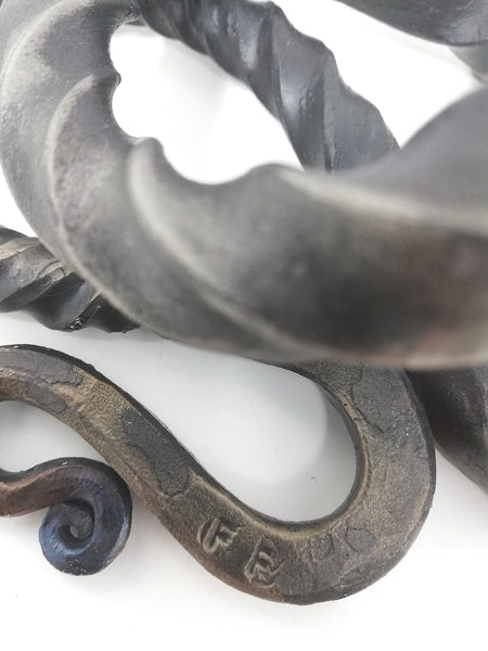 Tall 'basilisk' candle holder, hand forged.