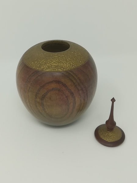 Turned wood ash jar with gold coloured detail and purple heart finial by Roderick Evans.
