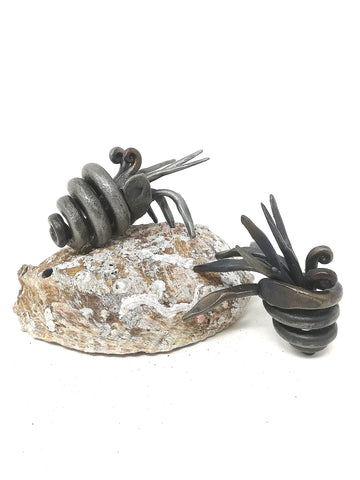 Little hand forged, mild steel, hermit crab sculpture.