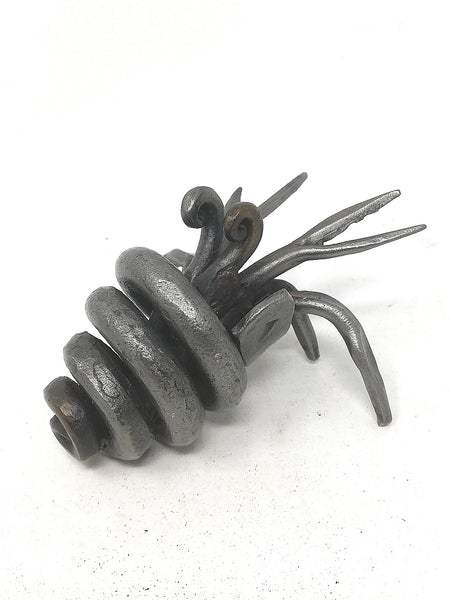 Little hand forged, mild steel, hermit crab sculpture.