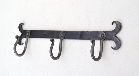 rack of three hand forged hooks
