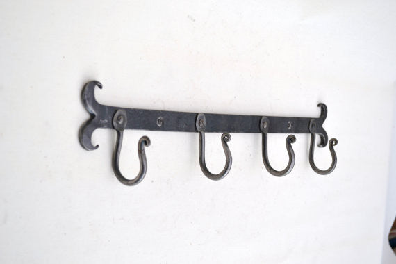 rack of four hand forged hooks